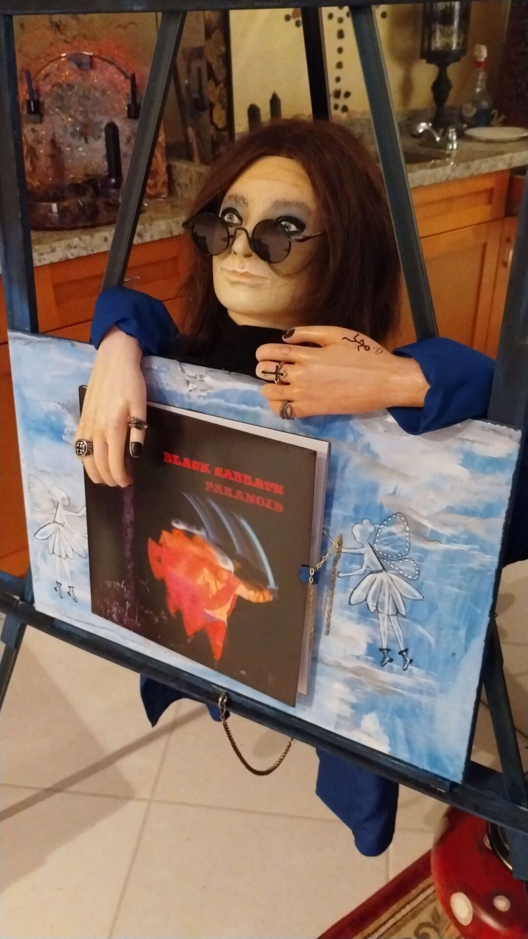 Mannequin with sunglasses and art display