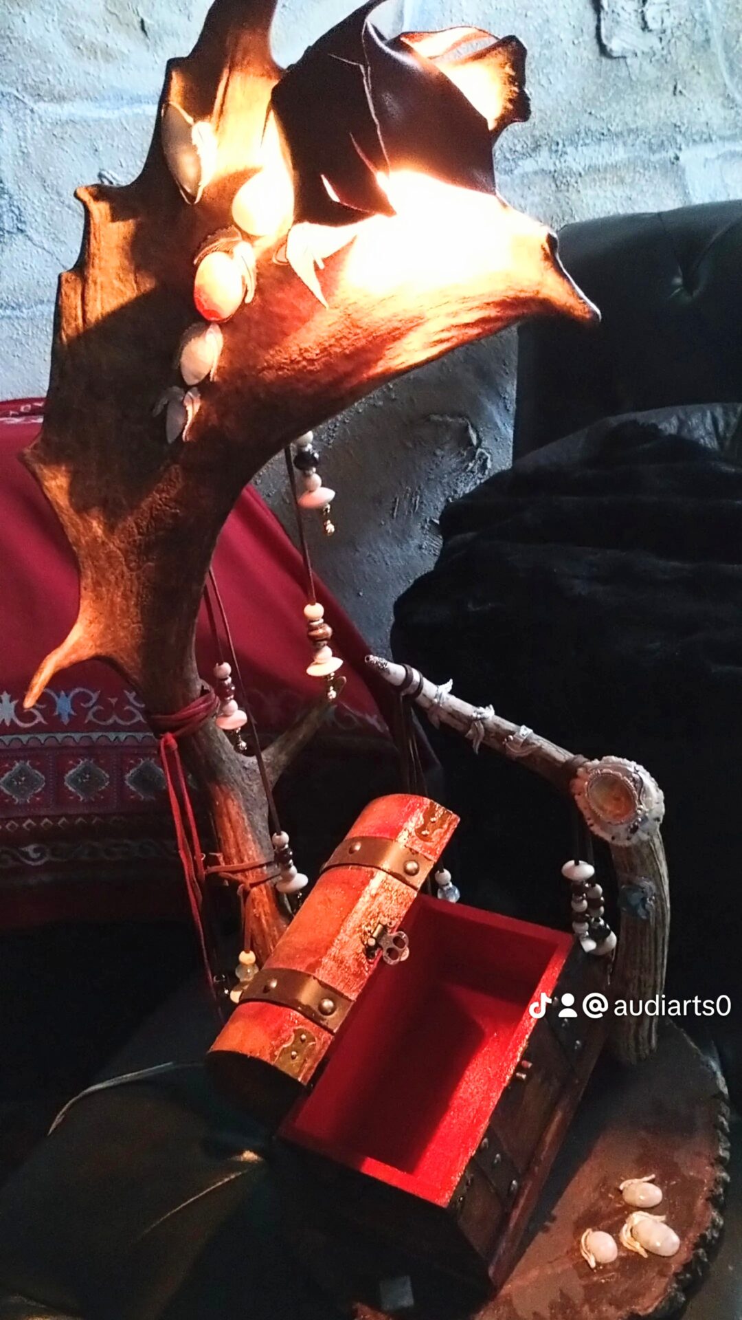 Intricate wooden dragon sculpture with detailed carving and red accents.