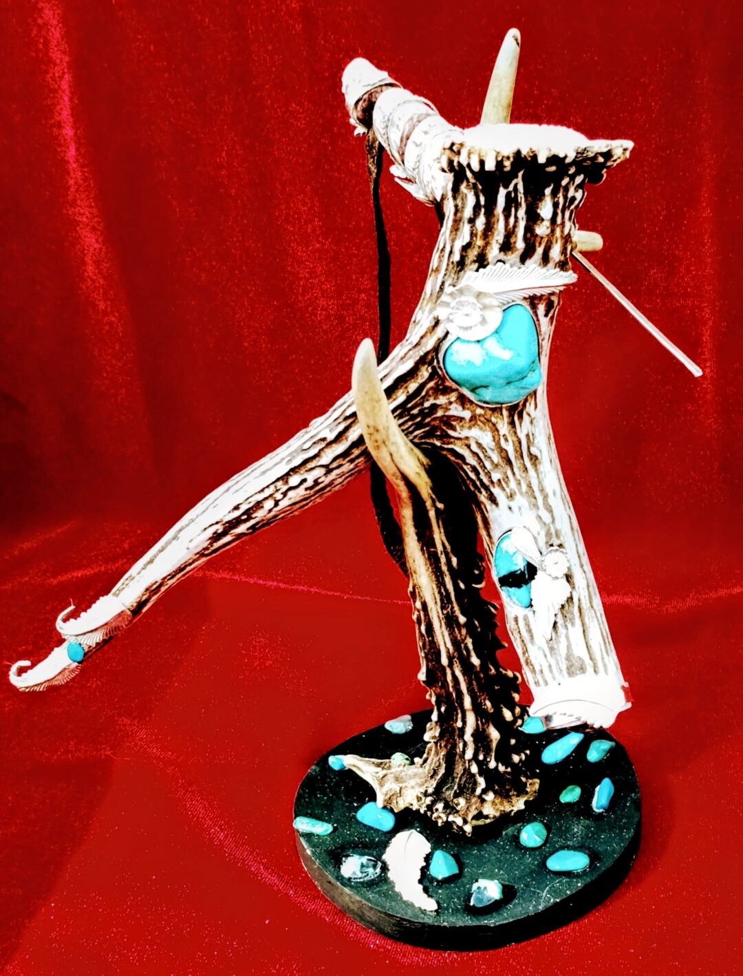 Artistic sculpture of a figure dancing on a textured base.