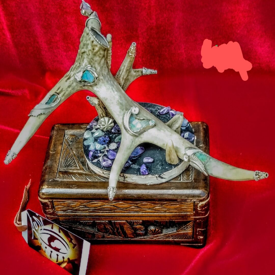 Artistic antler sculpture with purple stones