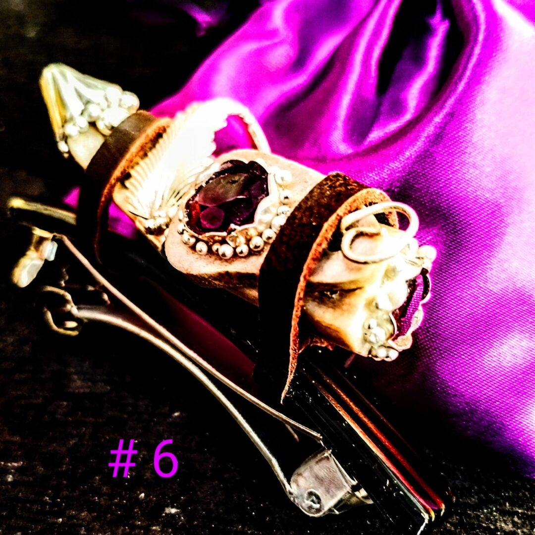 Decorative hair clip on purple fabric