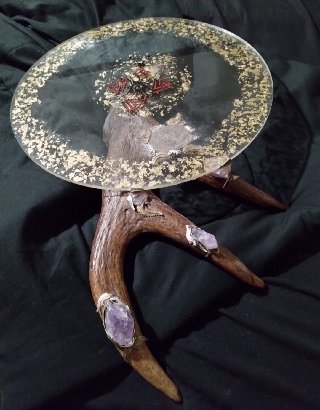 Unique table featuring antlers and crystals